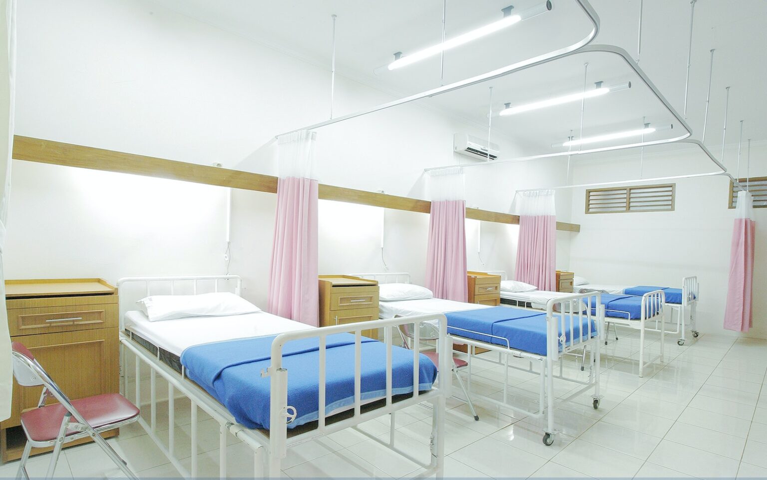 Empty Hospital Bed Inside Room